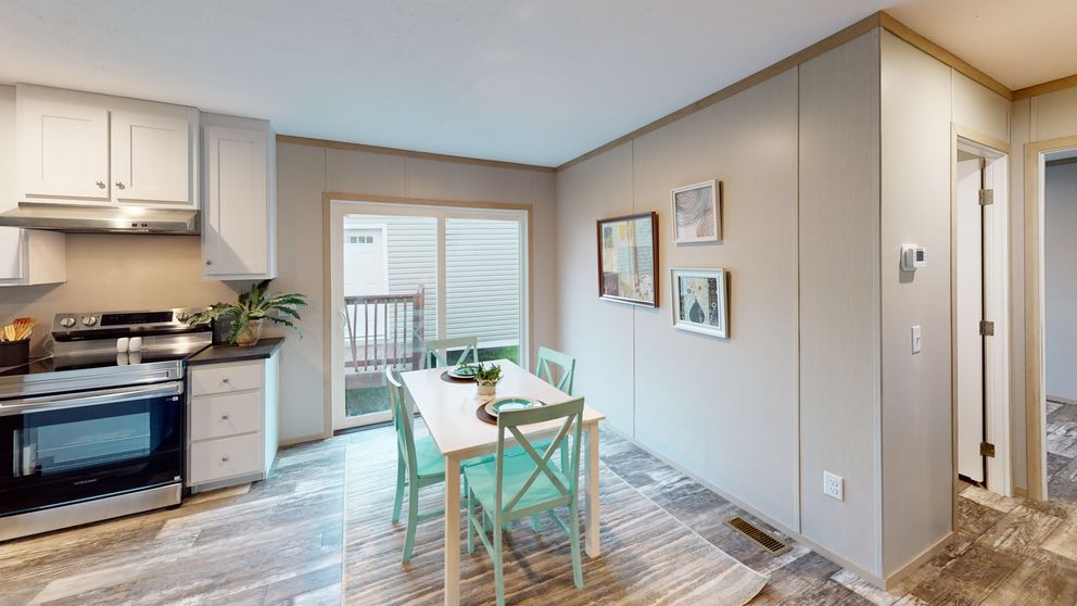The FRANKLIN Dining Area. This Manufactured Mobile Home features 3 bedrooms and 2 baths.