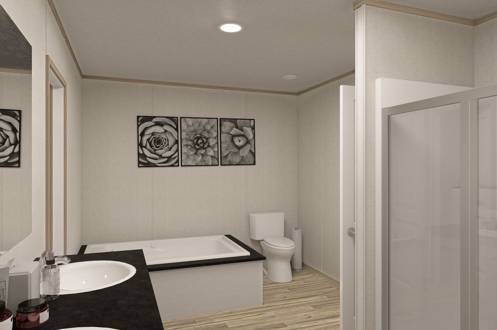 The THE EAGLE 76 Primary Bathroom. This Manufactured Mobile Home features 5 bedrooms and 2 baths.