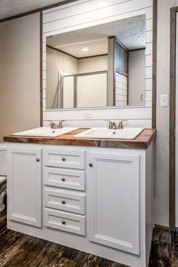 The ANNIVERSARY ENTERTAINER Exterior. This Manufactured Mobile Home features 3 bedrooms and 2 baths.