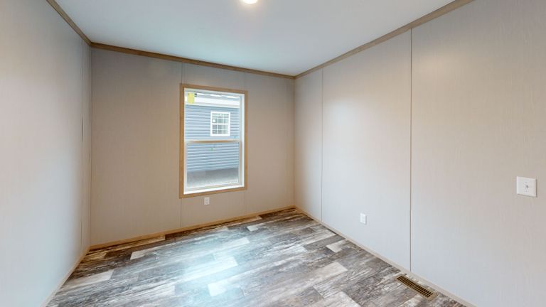 The HANCOCK Guest Bedroom. This Manufactured Mobile Home features 4 bedrooms and 2 baths.