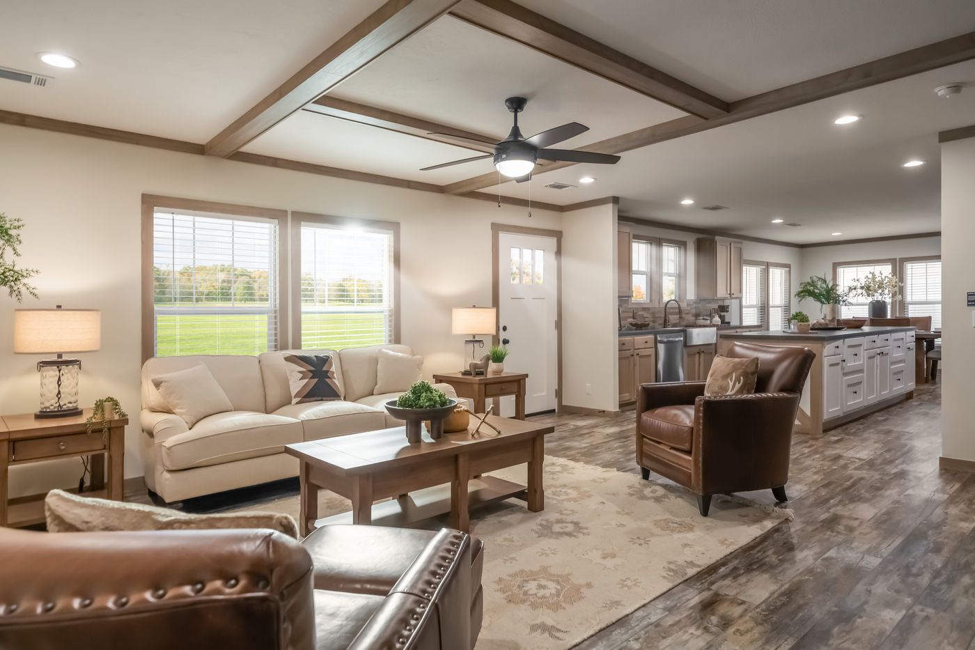 The BOUJEE PREMIER Living Room. This Manufactured Mobile Home features 4 bedrooms and 2 baths.