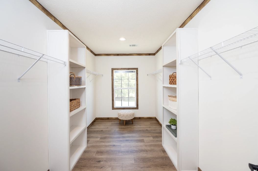 The ARABELLA Primary Bedroom Closet. This Manufactured Mobile Home features 3 bedrooms and 2 baths.