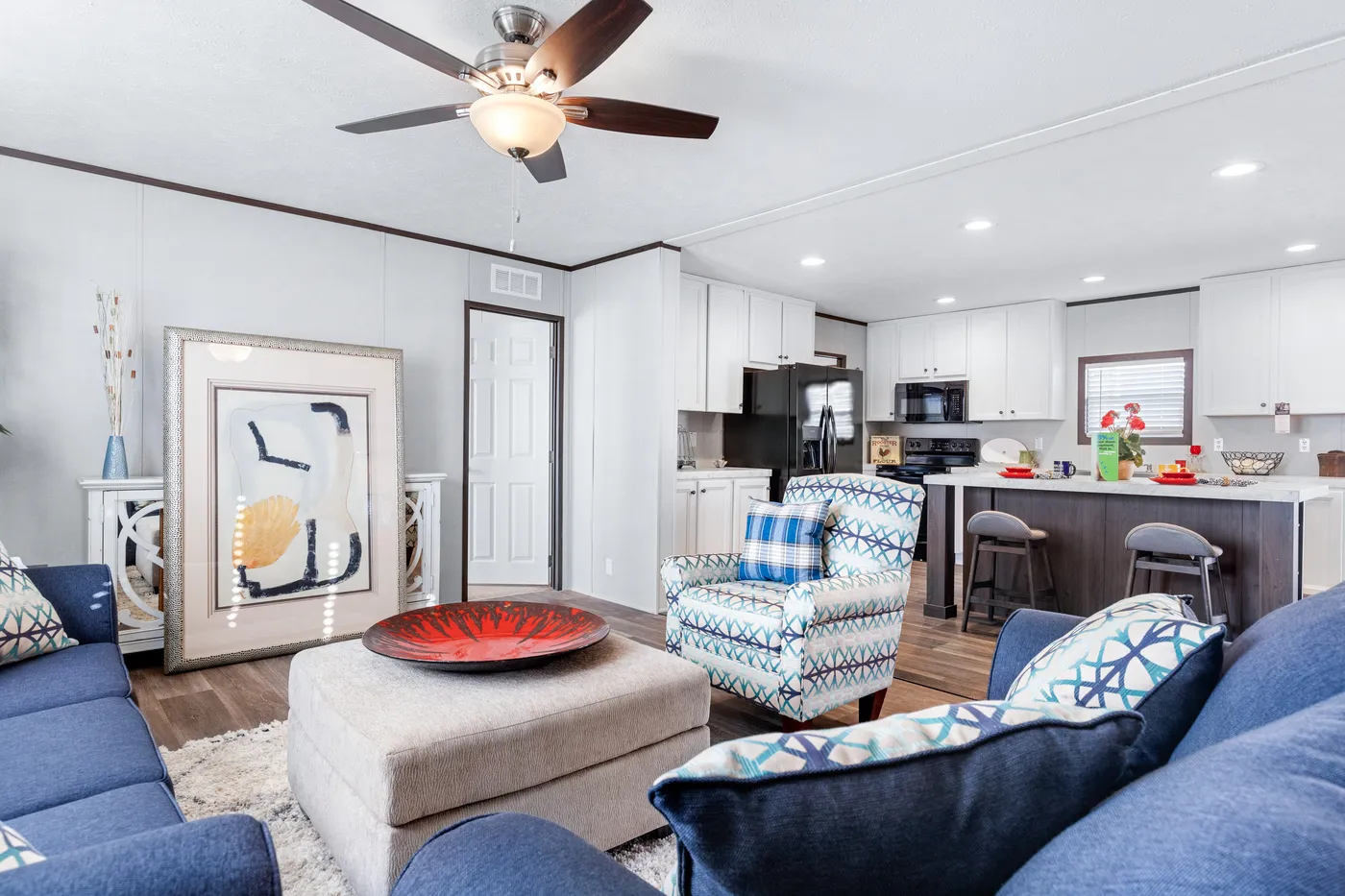 The THE SUNDOWNER Living Room. This Manufactured Mobile Home features 3 bedrooms and 2 baths.
