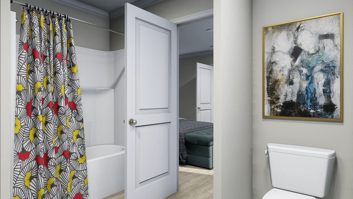 The 7010 "YADKIN" 7616 Primary Bathroom. This Manufactured Mobile Home features 3 bedrooms and 2 baths.