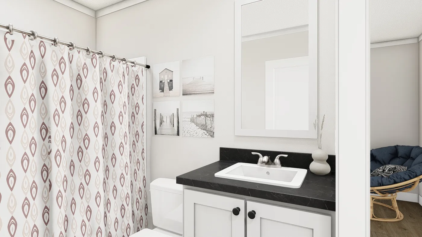 The SWEET CAROLINE Guest Bathroom. This Manufactured Mobile Home features 3 bedrooms and 2 baths.
