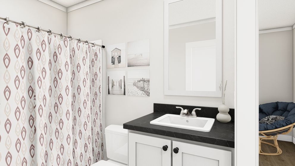 The SWEET CAROLINE Guest Bathroom. This Manufactured Mobile Home features 3 bedrooms and 2 baths.