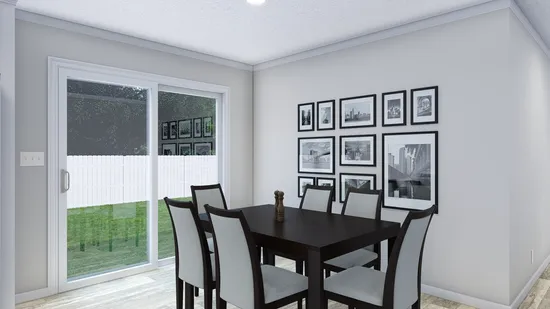 The THE BIG EASY Dining Area. This Manufactured Mobile Home features 4 bedrooms and 3 baths.