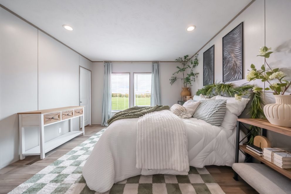 The VISTA Primary Bedroom. This Manufactured Mobile Home features 3 bedrooms and 2 baths.