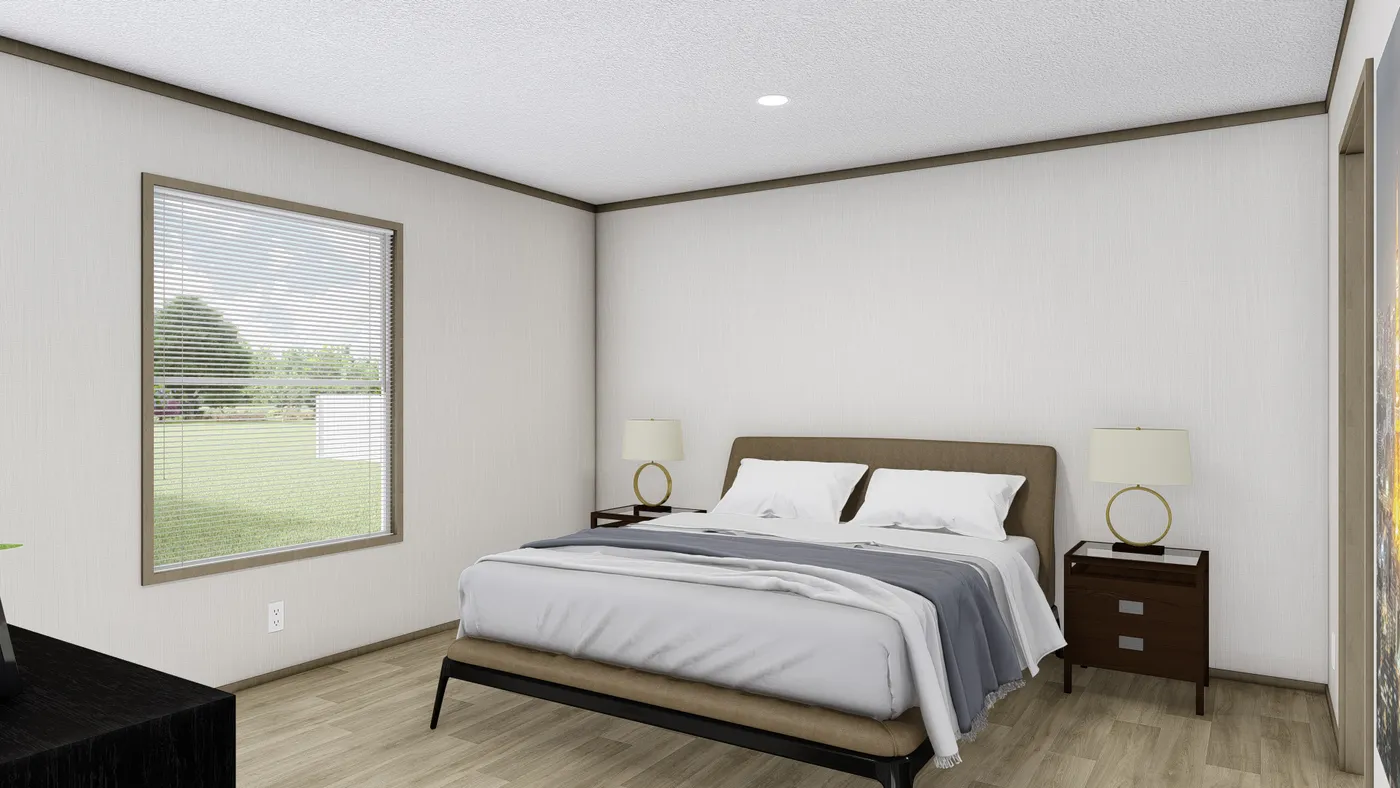 The BOONE Primary Bedroom. This Manufactured Mobile Home features 4 bedrooms and 2 baths.