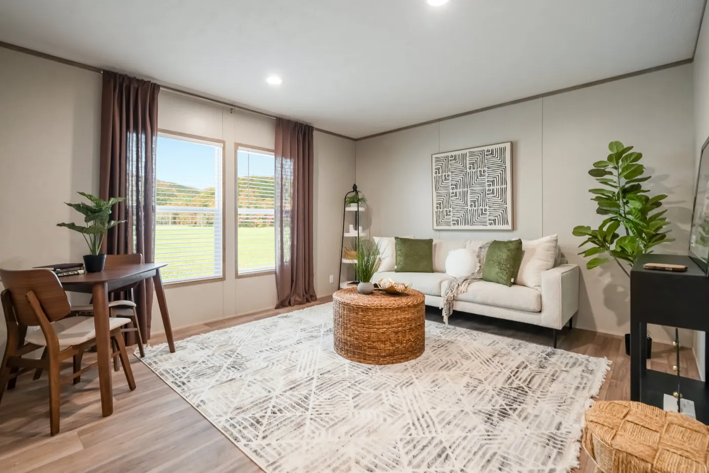 The ECLIPSE Sitting Room. This Manufactured Mobile Home features 4 bedrooms and 2 baths.