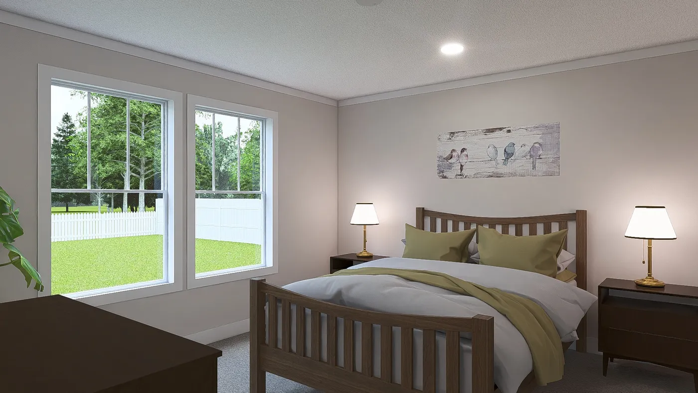 The HEY JUDE Primary Bedroom. This Manufactured Mobile Home features 4 bedrooms and 2 baths.