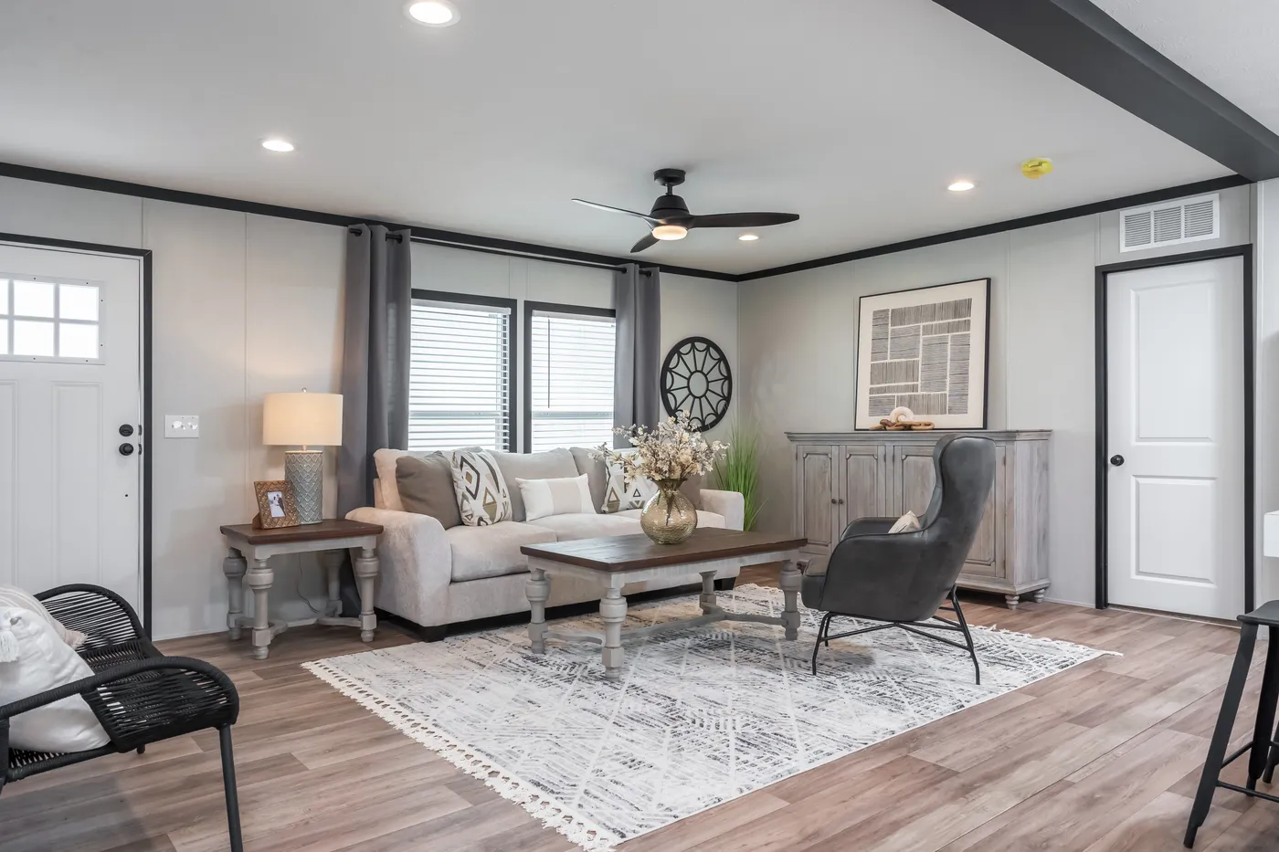 The ABSOLUTE VALUE Living Room. This Manufactured Mobile Home features 4 bedrooms and 2 baths.