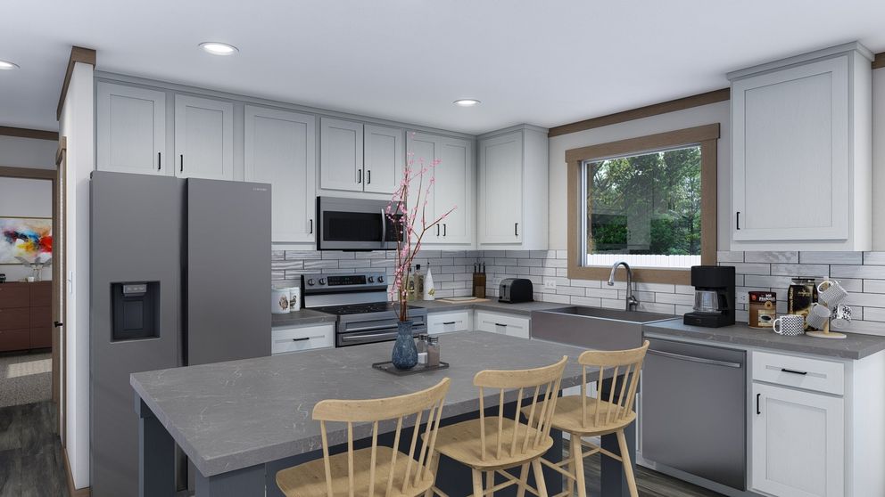 The TRINITY 60 Kitchen. This Manufactured Mobile Home features 2 bedrooms and 2 baths.