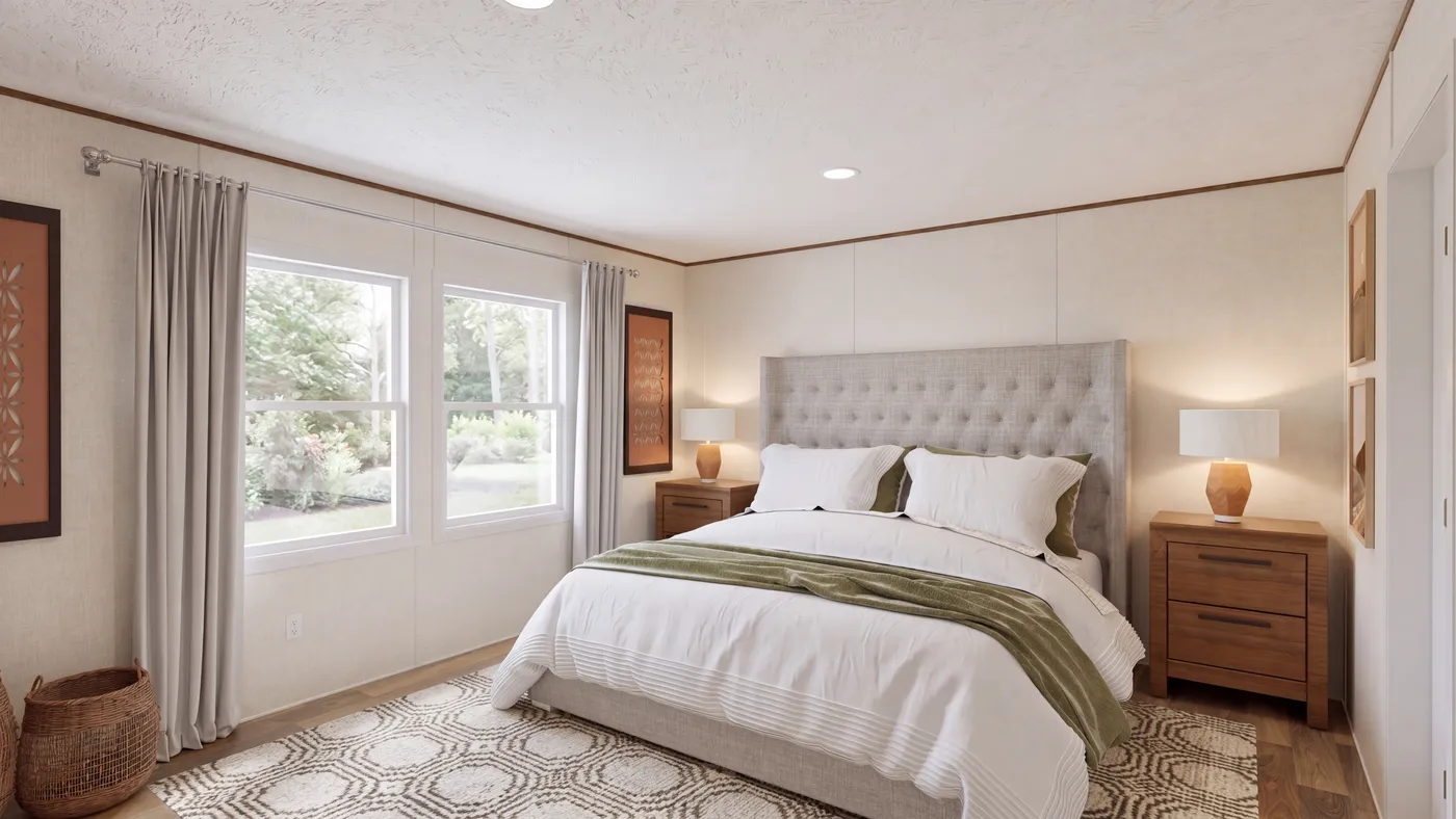 The CEDAR Primary Bedroom. This Manufactured Mobile Home features 3 bedrooms and 2 baths.
