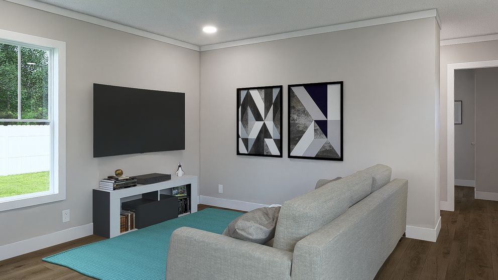 The STILL THE ONE Living Room. This Manufactured Mobile Home features 2 bedrooms and 2 baths.