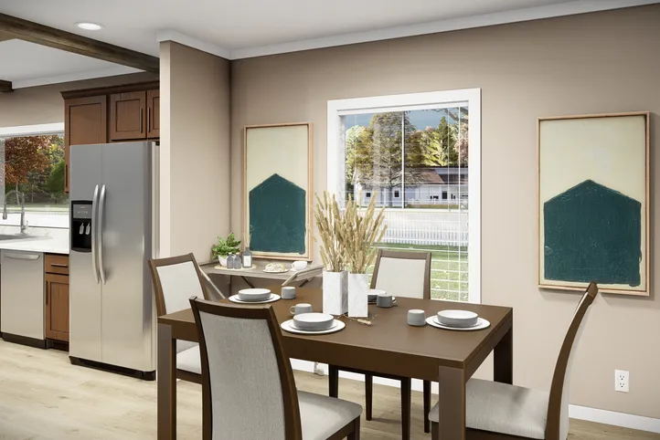 The THE BRYANT Dining Area. This Manufactured Mobile Home features 4 bedrooms and 2 baths.