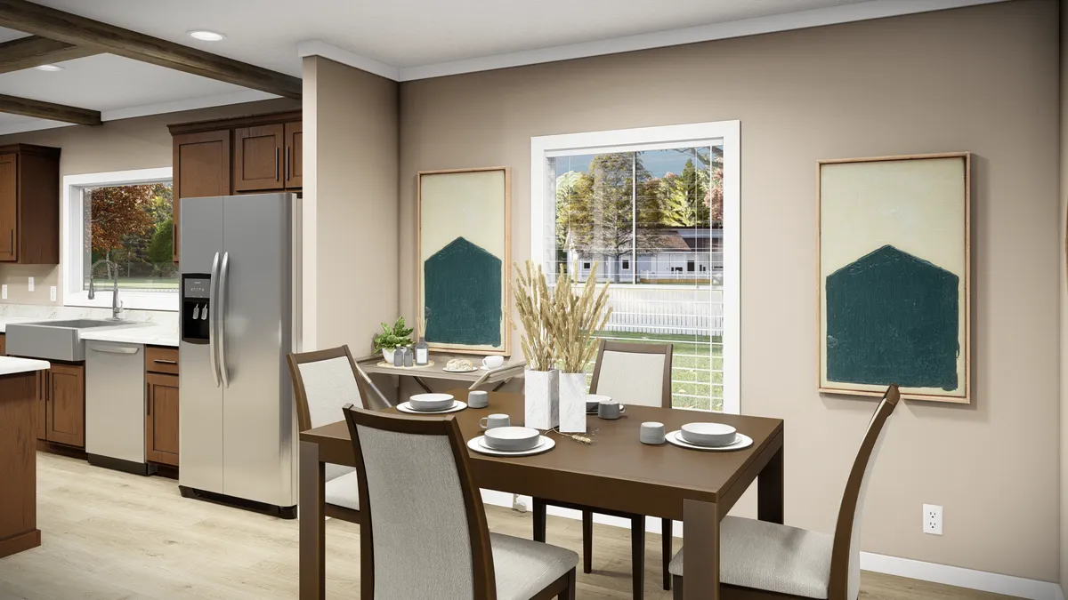 The THE BRYANT Dining Area. This Manufactured Mobile Home features 4 bedrooms and 2 baths.