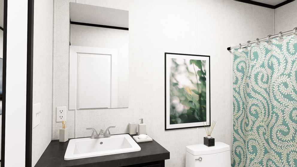 The SOLACE Guest Bathroom. This Manufactured Mobile Home features 4 bedrooms and 2 baths.
