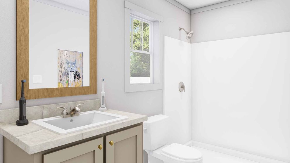 The STILL THE ONE Primary Bathroom. This Manufactured Mobile Home features 2 bedrooms and 2 baths.