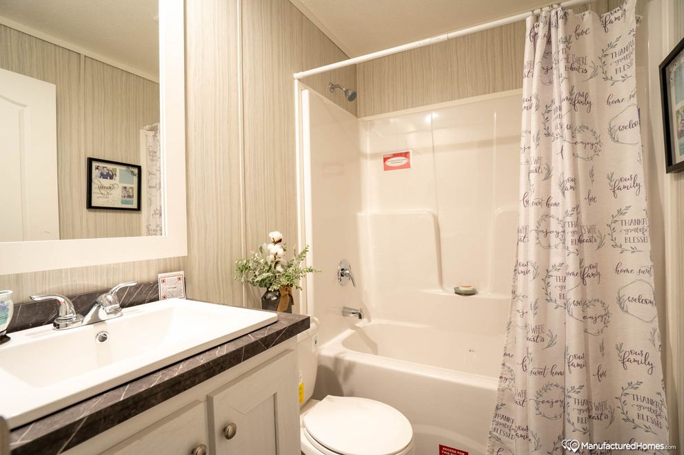 The TOPAZ 70 Guest Bathroom. This Manufactured Mobile Home features 3 bedrooms and 2 baths.