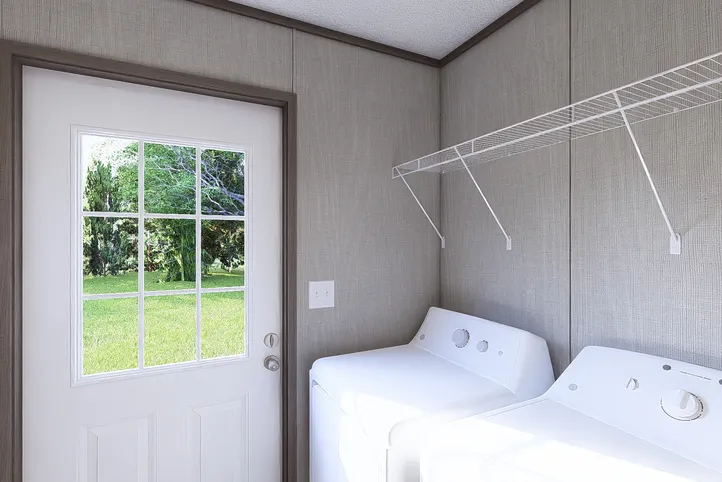 The LEGEND BIG BOY Utility Room. This Manufactured Mobile Home features 4 bedrooms and 2 baths.