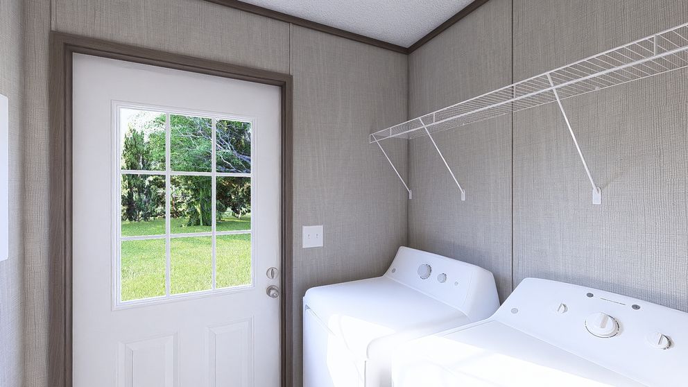 The LEGEND BIG BOY Utility Room. This Manufactured Mobile Home features 4 bedrooms and 2 baths.