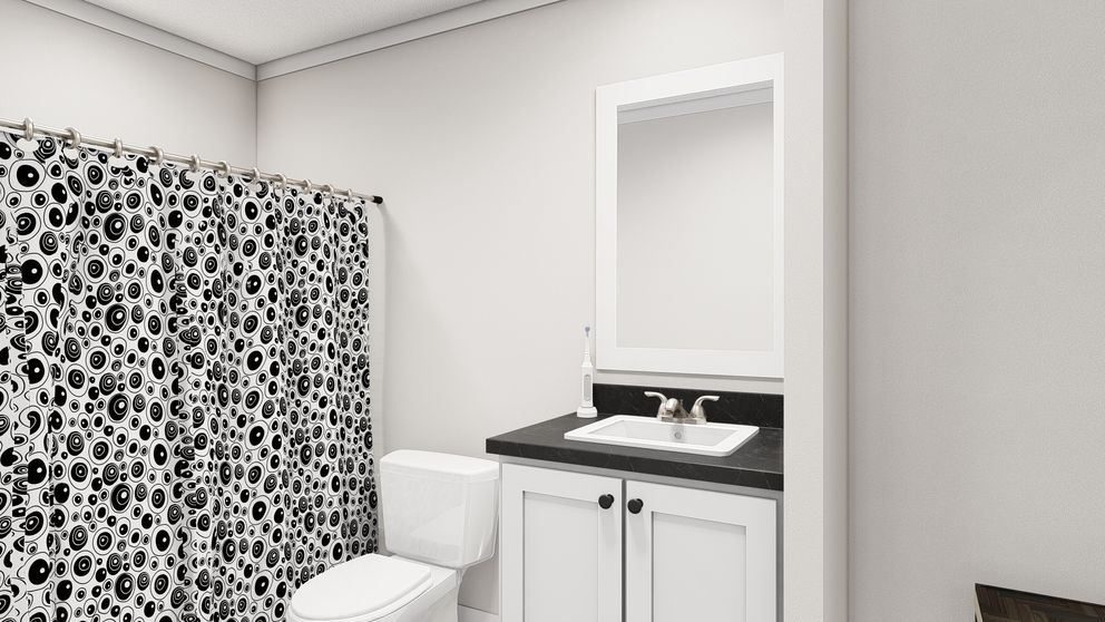 The WHOLE LOTTA LOVE Guest Bathroom. This Manufactured Mobile Home features 3 bedrooms and 2 baths.