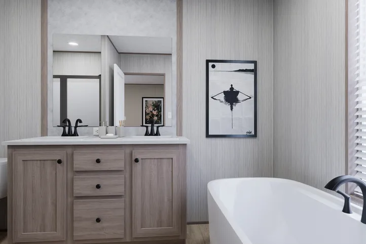 The THE ANNIVERSARY 76 Primary Bathroom. This Manufactured Mobile Home features 3 bedrooms and 2 baths.