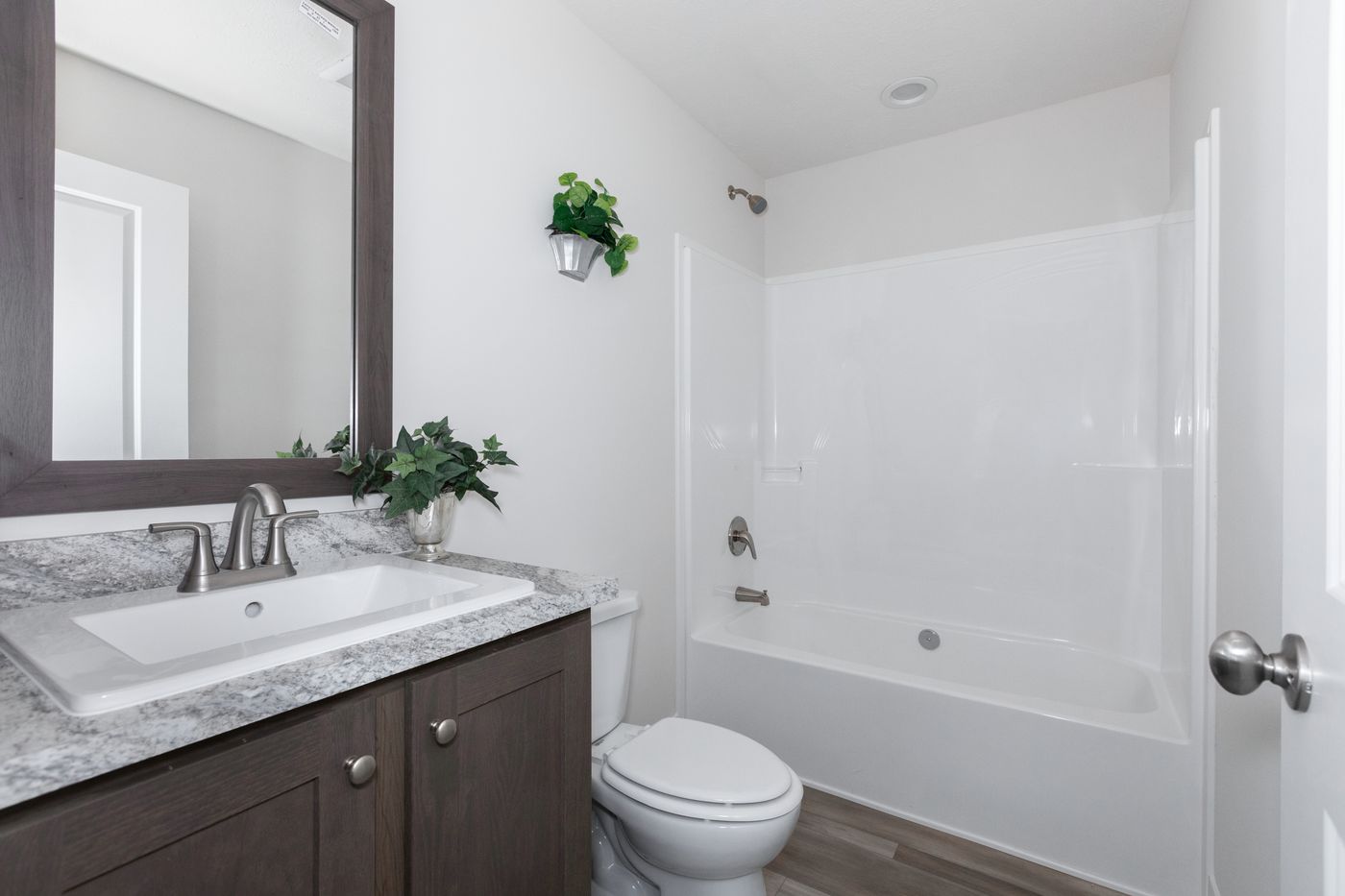 The HILL ST/5628-MS020-1 SECT Guest Bathroom. This Manufactured Mobile Home features 3 bedrooms and 2 baths.