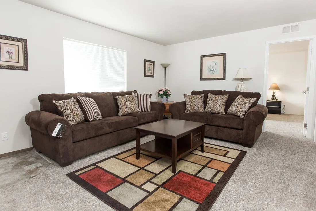 The 2015 COLUMBIA RIVER (NEW) Family Room. This Manufactured Mobile Home features 3 bedrooms and 2 baths.