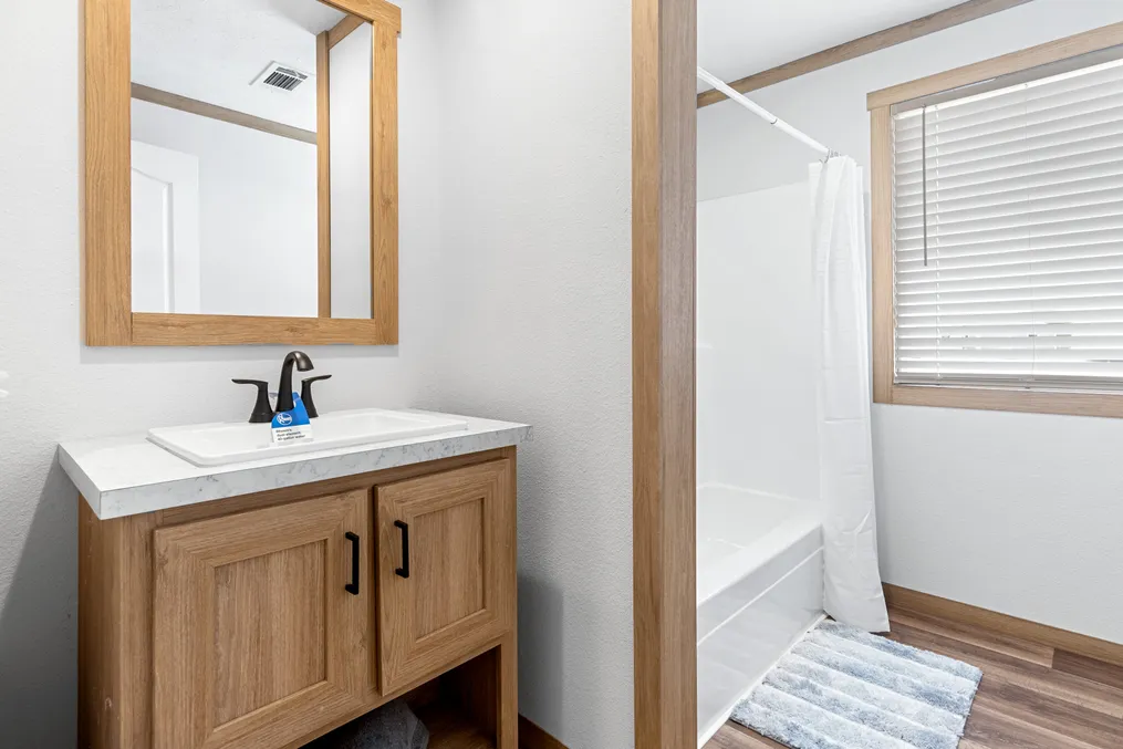 The HARPER Guest Bathroom. This Manufactured Mobile Home features 3 bedrooms and 2 baths.