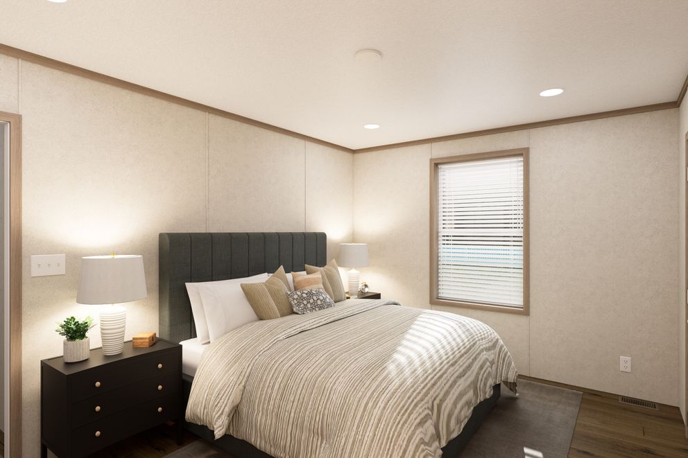 The 7016-CC01 CORNERSTONE 70 Primary Bedroom. This Manufactured Mobile Home features 3 bedrooms and 2 baths.