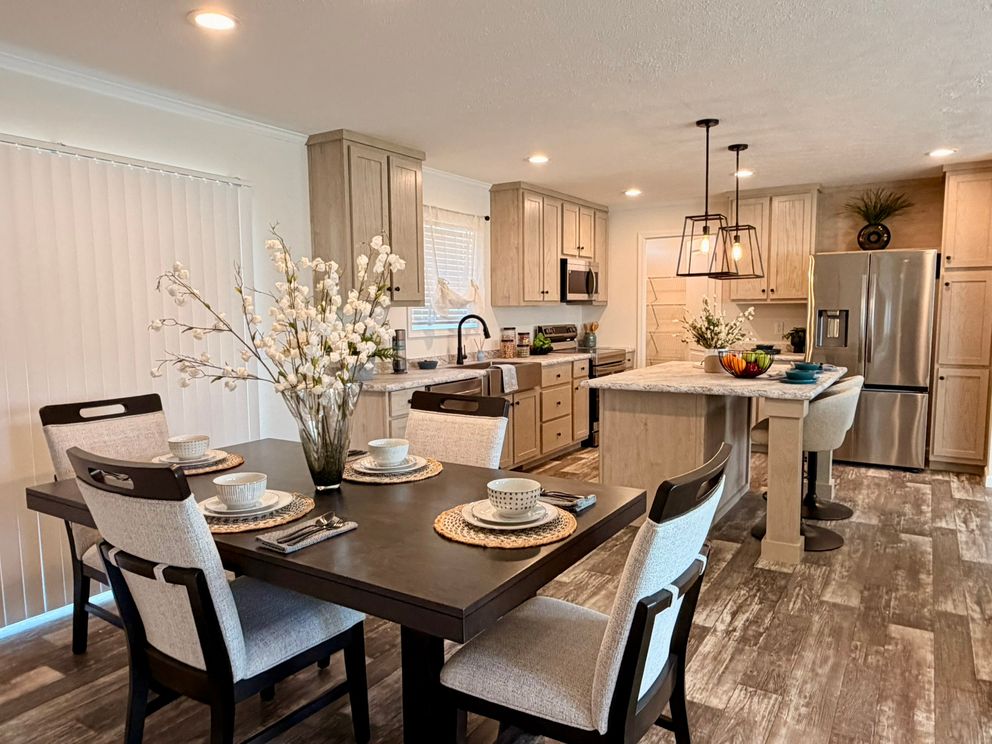 The TOURMALINE 7628-649 Dining Area. This Manufactured Mobile Home features 4 bedrooms and 2 baths.