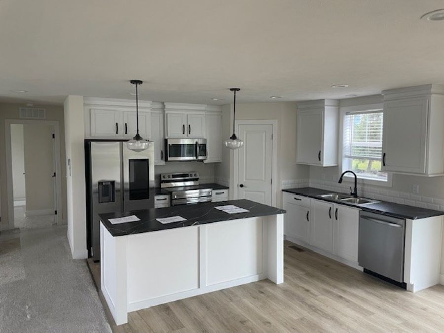 The SPRING MEADOW/4828-MS007-1 SEC Kitchen. This Manufactured Mobile Home features 3 bedrooms and 2 baths.