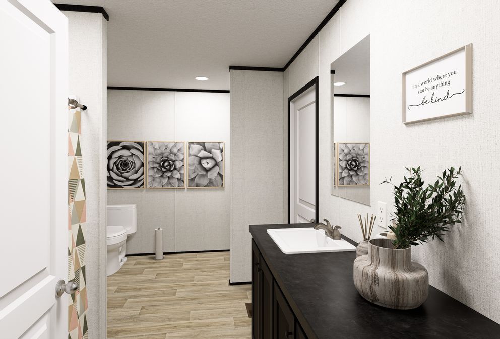 The ECLIPSE Primary Bathroom. This Manufactured Mobile Home features 4 bedrooms and 2 baths.