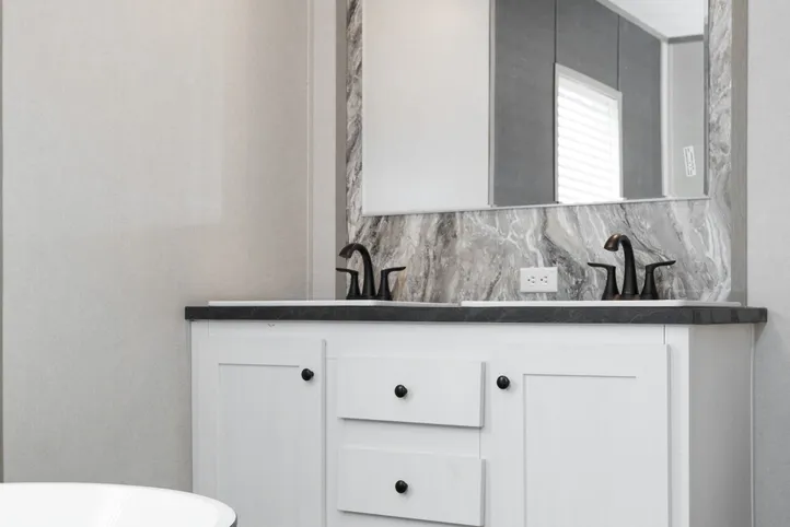 The PLATINUM ANNIVERSARY Primary Bathroom. This Manufactured Mobile Home features 3 bedrooms and 2 baths.