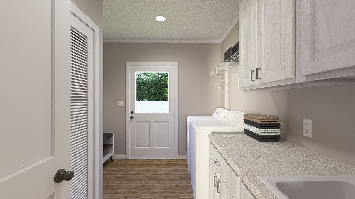 The THE HEXAGON Utility Room. This Manufactured Mobile Home features 4 bedrooms and 3 baths.