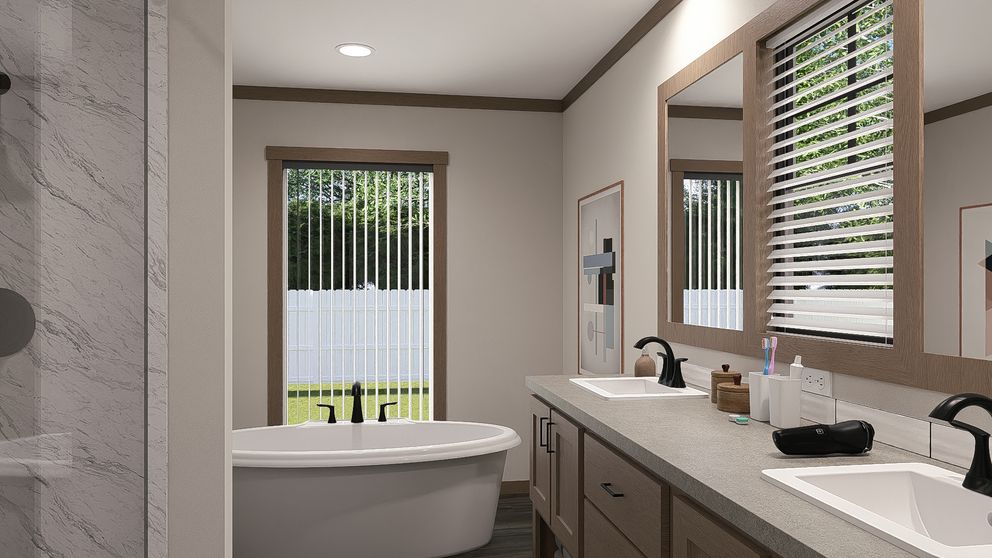 The LIZZIE Primary Bathroom. This Manufactured Mobile Home features 3 bedrooms and 2 baths.