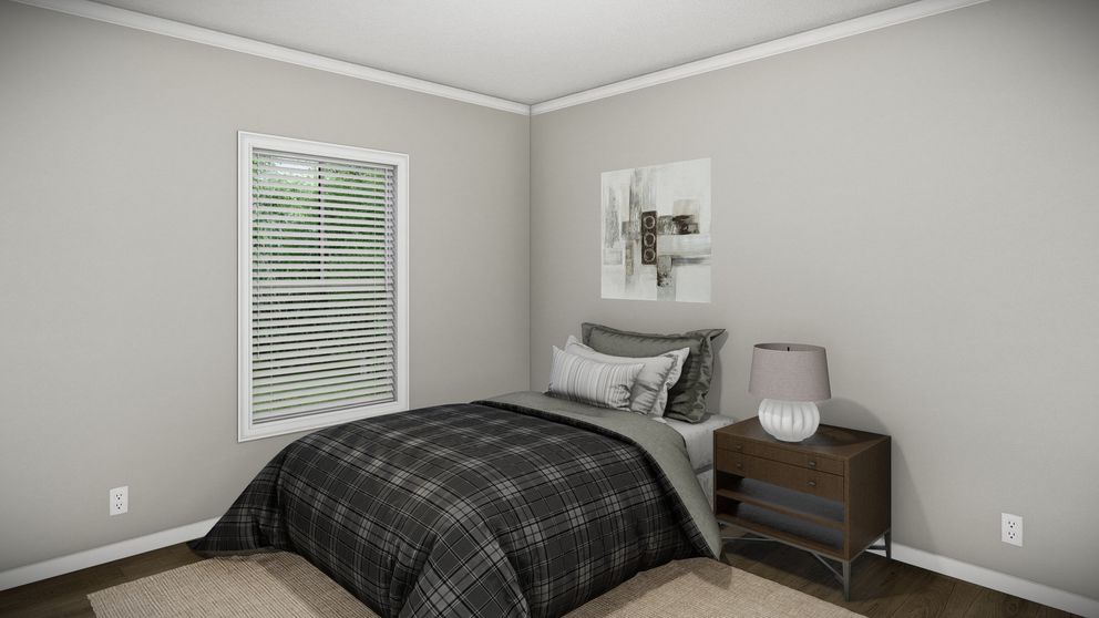 The HUXTON II Guest Bedroom. This Manufactured Mobile Home features 4 bedrooms and 2 baths.