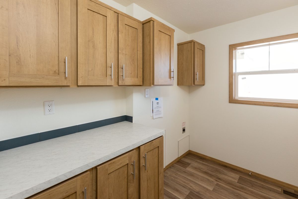 The THE ANTHONY Utility Room. This Manufactured Mobile Home features 2 bedrooms and 2 baths.