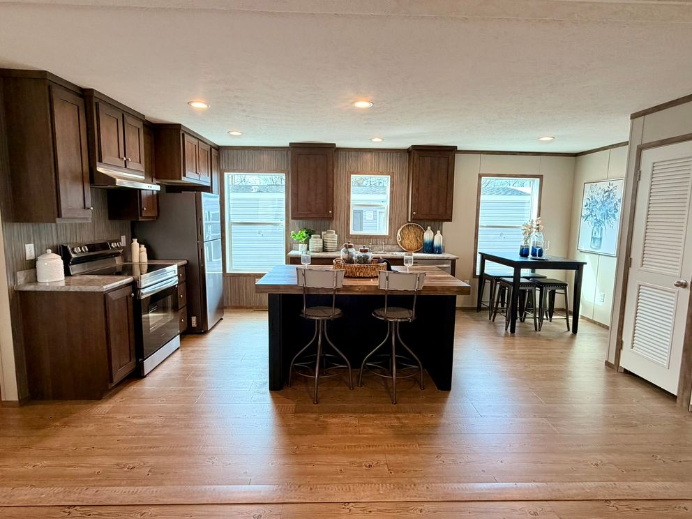 The APATITE Dining Area. This Manufactured Mobile Home features 3 bedrooms and 2 baths.