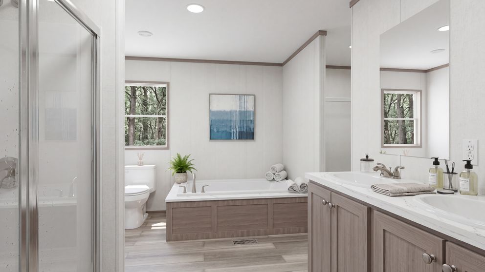 The THE MOUNTAINEER 60 Primary Bathroom. This Manufactured Mobile Home features 3 bedrooms and 2 baths.