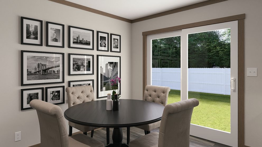 The LIZZIE Dining Room. This Manufactured Mobile Home features 3 bedrooms and 2 baths.