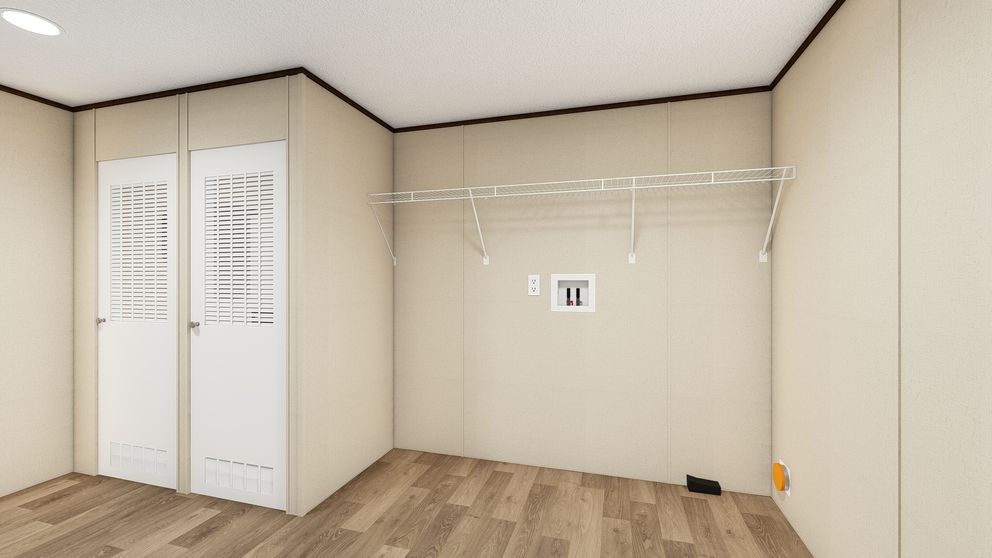 The TRIUMPH Utility Room. This Manufactured Mobile Home features 5 bedrooms and 3 baths.