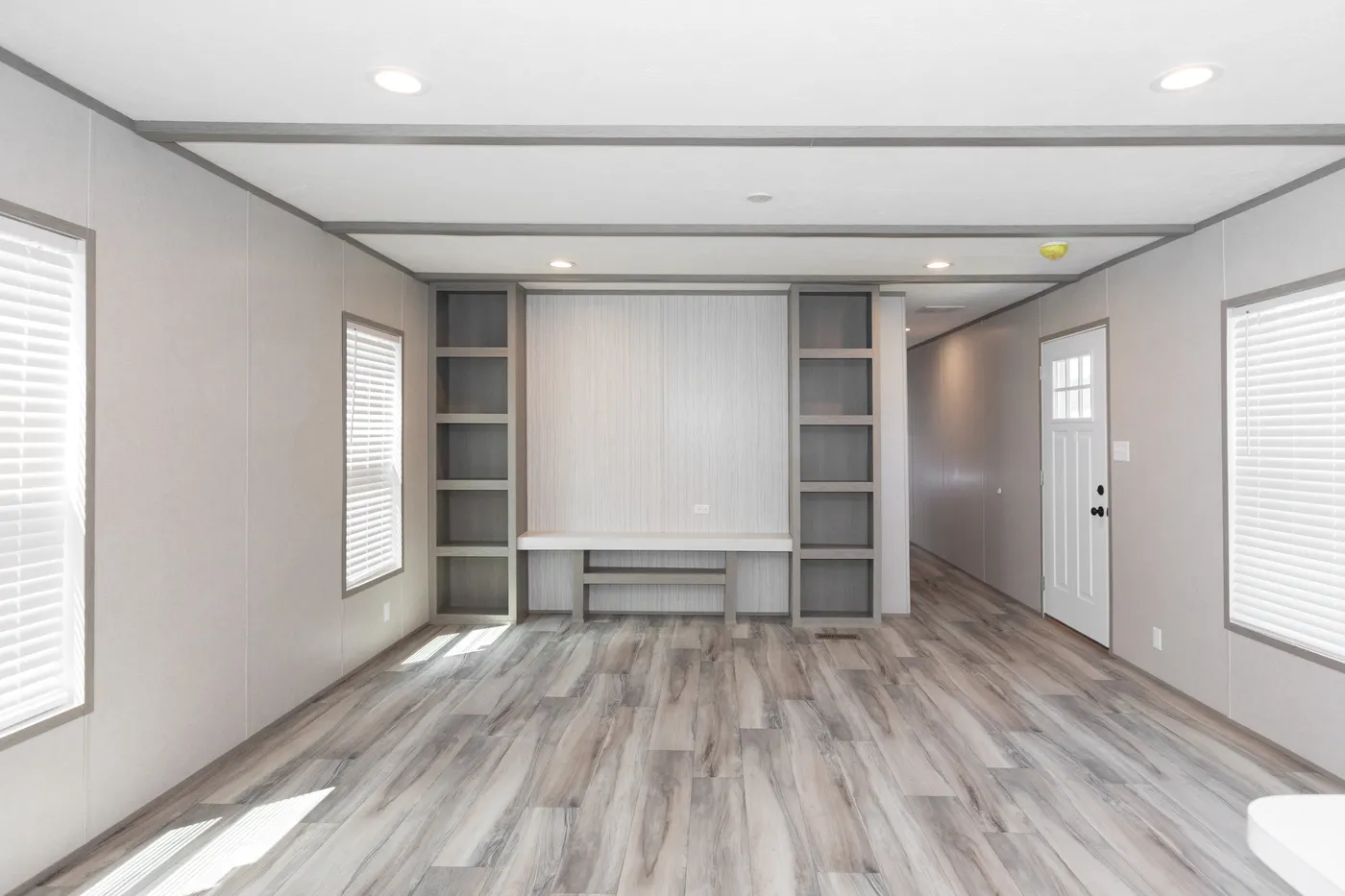 The THE ANNIVERSARY 76 Living Room. This Manufactured Mobile Home features 3 bedrooms and 2 baths.