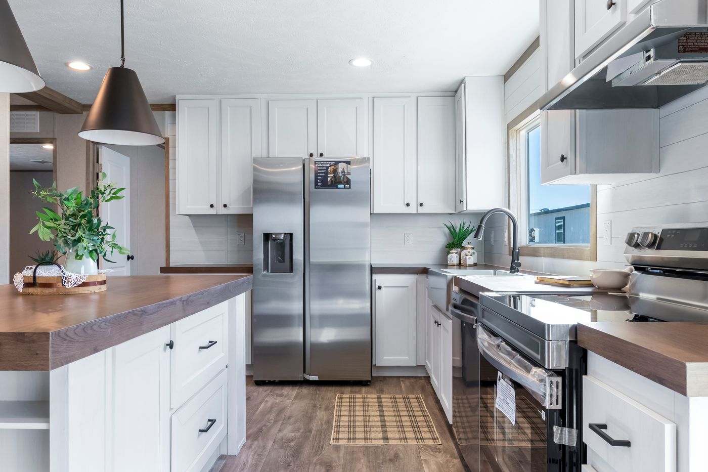 The THE BIG DEAL 52 Kitchen. This Manufactured Mobile Home features 3 bedrooms and 2 baths.