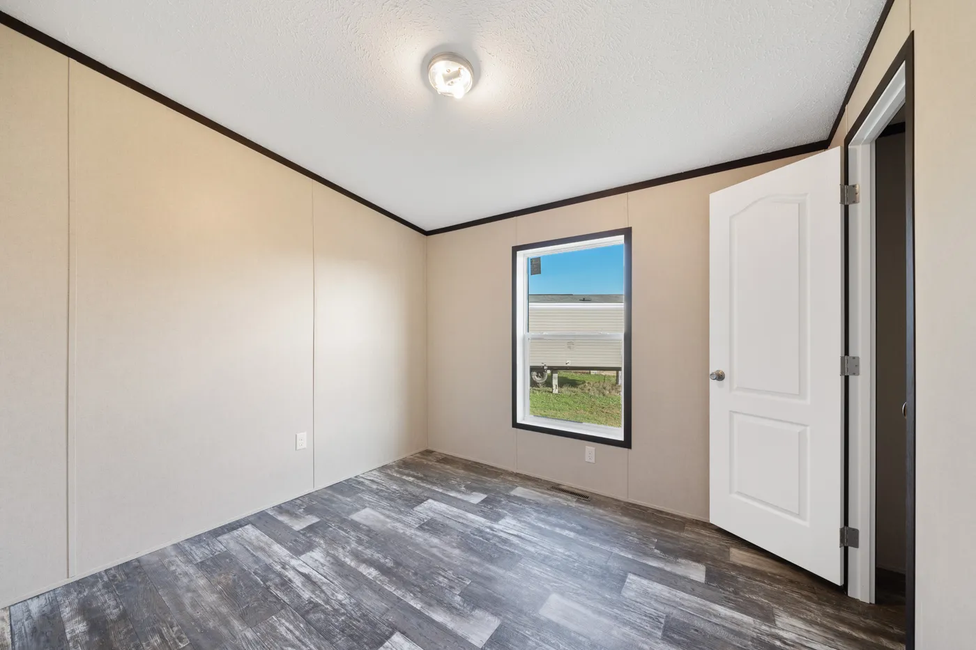 The GARNET Guest Bedroom. This Manufactured Mobile Home features 3 bedrooms and 2 baths.