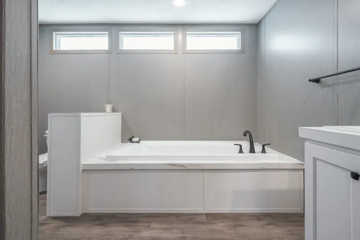 The BLUEBONNET BREEZE Primary Bathroom. This Manufactured Mobile Home features 3 bedrooms and 2 baths.