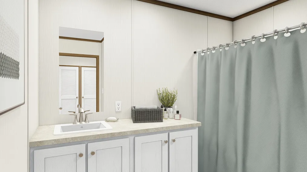 The THE REVEAL Guest Bathroom. This Manufactured Mobile Home features 3 bedrooms and 2 baths.