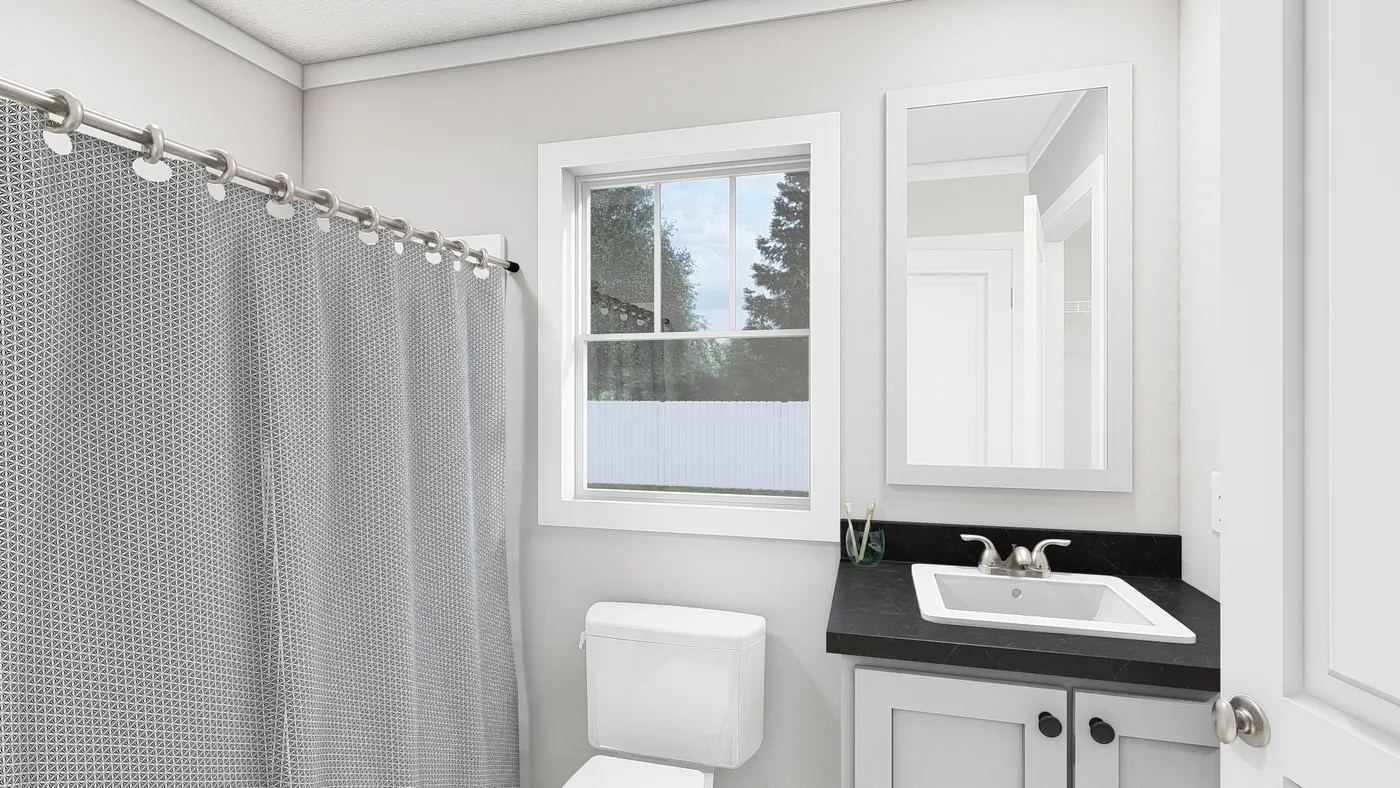 The YESTERDAY Primary Bathroom. This Manufactured Mobile Home features 1 bedroom and 1 bath.